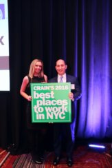 Photo of Adam Leitman Bailey holding Crain's 2016 Best Places to Work poster