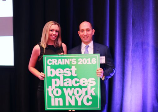 Photo of Adam Leitman Bailey holding Crain's 2016 Best Places to Work poster