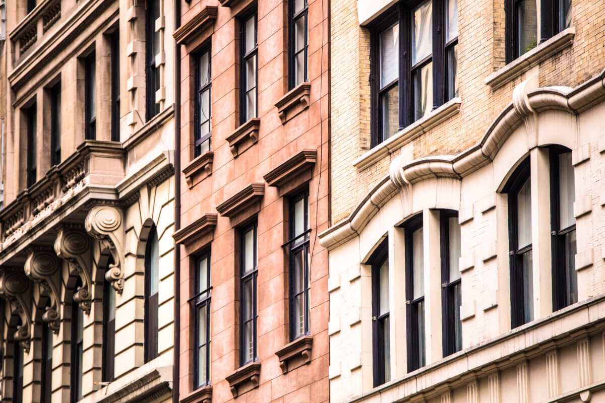 Architectural details of vintage brick apartment buildings in New York City.