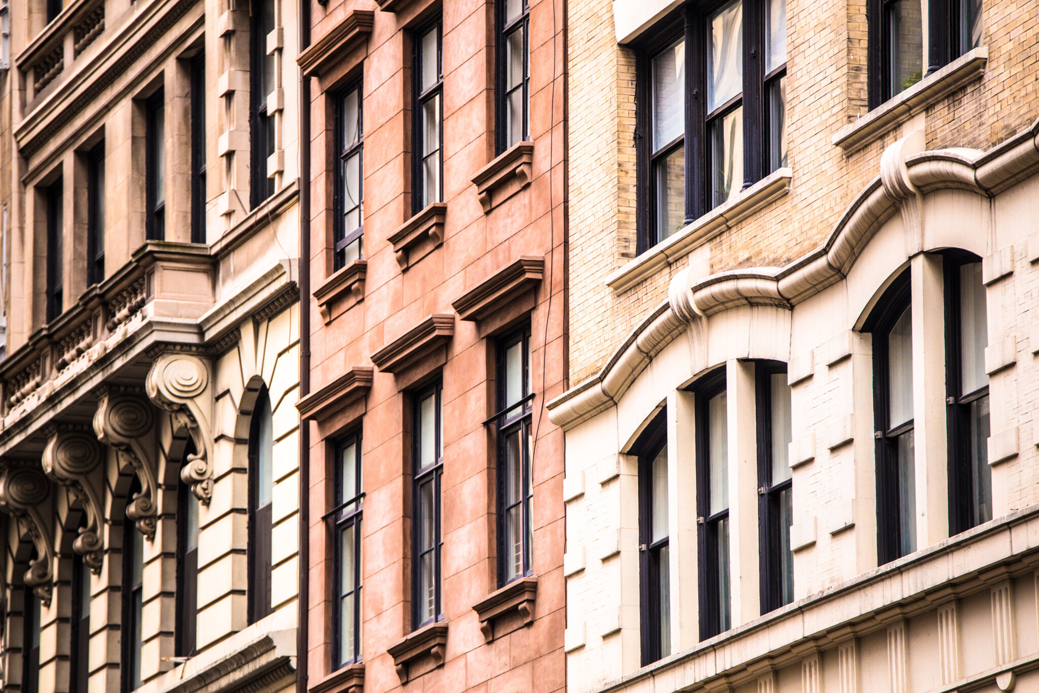 Architectural details of vintage brick apartment buildings in New York City.